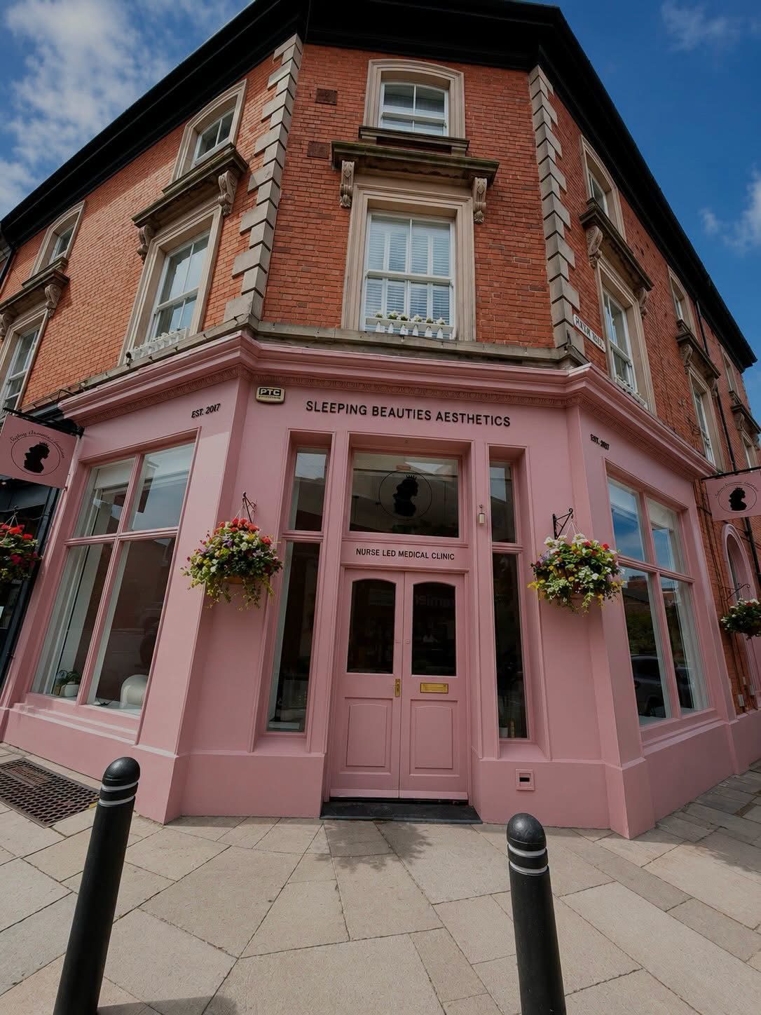 The pink Sleeping Beauties Aesthetics clinic on the corner of Christchurch Road, Oxton Village, Wirral